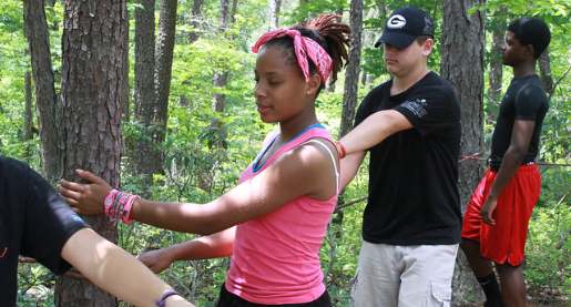 african american teen girl, white teen boy, eyes closed, in forest