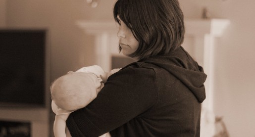 mom holding a baby in her arms